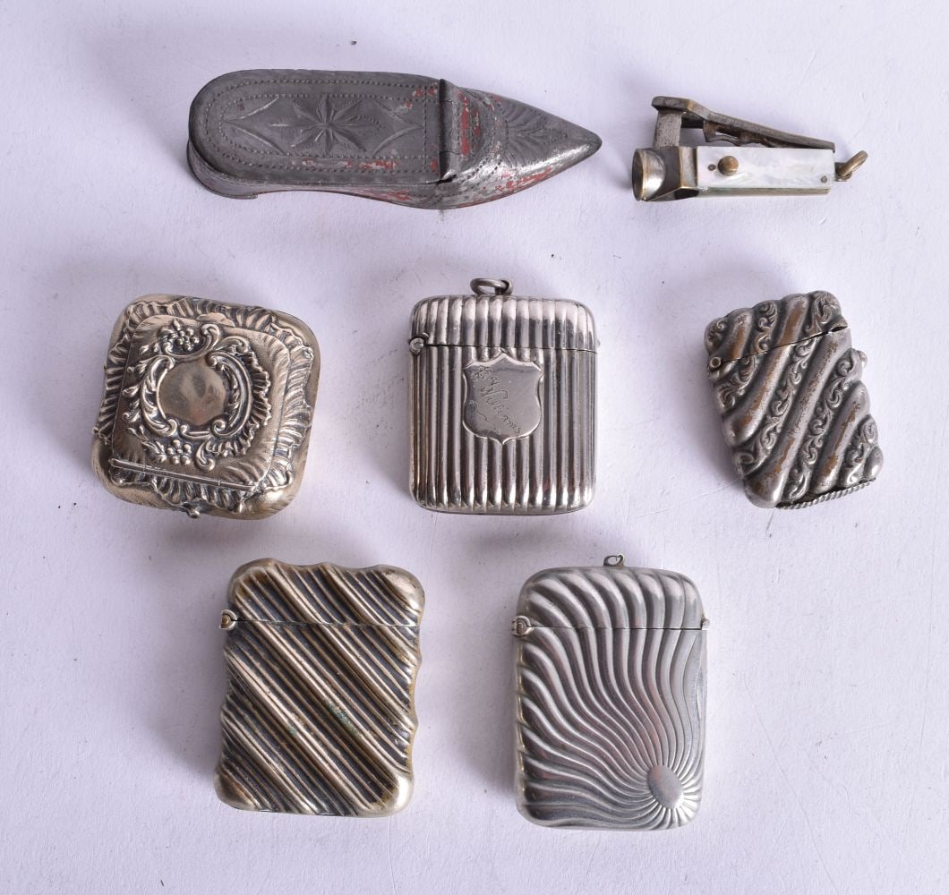Five Antique Vesta Cases with a Pill Box and a Cheroot Cutter. Largest 8.7cm x 2.6 cm x 1.9cm (7): Five Antique Vesta Cases with a Pill Box and a Cheroot Cutter. Largest 8.7cm x 2.6 cm x 1.9cm (7)