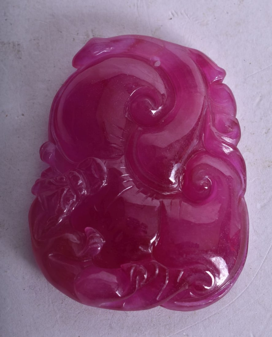 A CHINESE CARVED TOURMALINE PLAQUE. 40.8 grams. 5.5 cm x 4.25 cm.: A CHINESE CARVED TOURMALINE PLAQUE. 40.8 grams. 5.5 cm x 4.25 cm.
