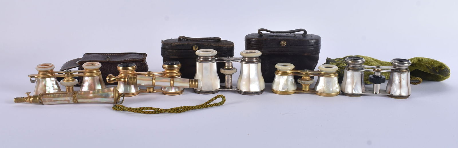 A COLLECTION OF MOTHER OF PEARL OPERA GLASSES. Largest 18 cm wide extended. (5): A COLLECTION OF MOTHER OF PEARL OPERA GLASSES. Largest 18 cm wide extended. (5)