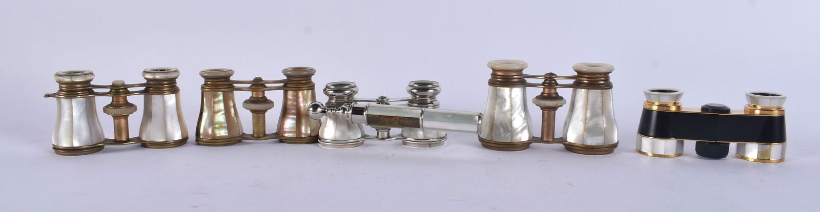 FIVE PAIRS OF MOTHER OF PEARL OPERA GLASSES. Largest 18 cm wide extended. (5): FIVE PAIRS OF MOTHER OF PEARL OPERA GLASSES. Largest 18 cm wide extended. (5)