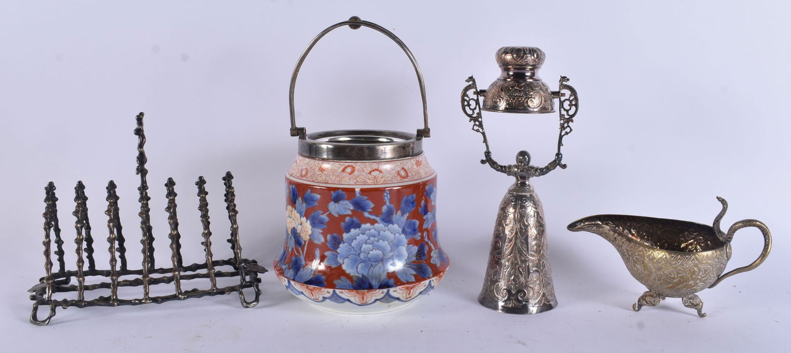AN ANTIQUE NOVELTY SILVER PLATED TOAST RACK and a wagering cup etc. (4): AN ANTIQUE NOVELTY SILVER PLATED TOAST RACK and a wagering cup etc. (4)