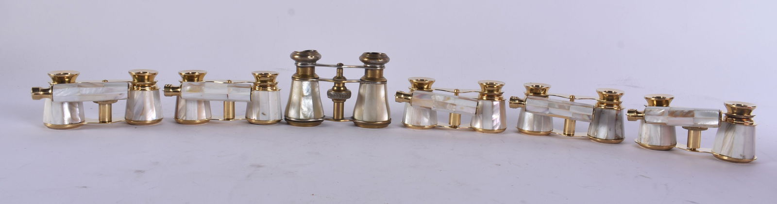 SIX PAIRS OF MOTHER OF PEARL OPERA GLASSES. Largest 18 cm wide extended. (6): SIX PAIRS OF MOTHER OF PEARL OPERA GLASSES. Largest 18 cm wide extended. (6)