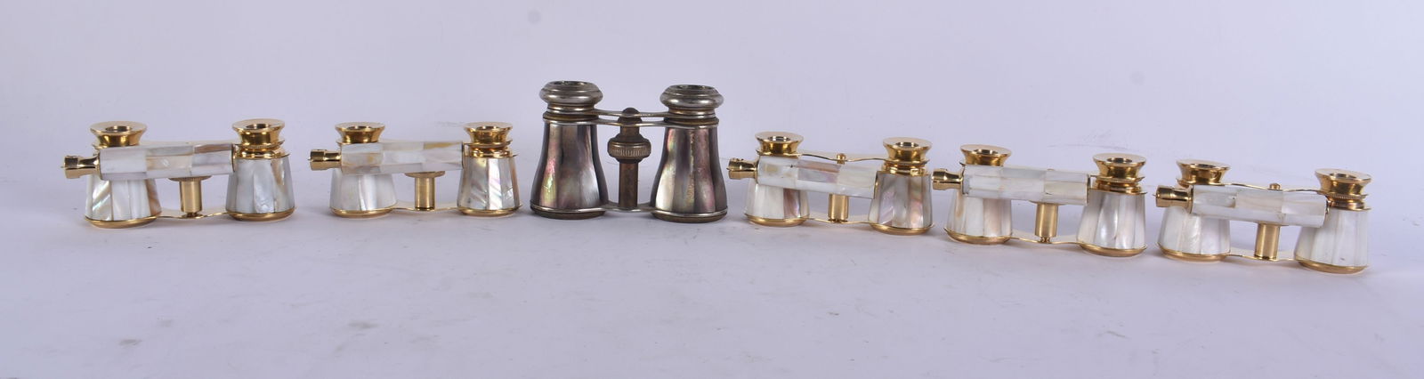 SIX PAIRS OF MOTHER OF PEARL OPERA GLASSES. Largest 18 cm wide extended. (6): SIX PAIRS OF MOTHER OF PEARL OPERA GLASSES. Largest 18 cm wide extended. (6)