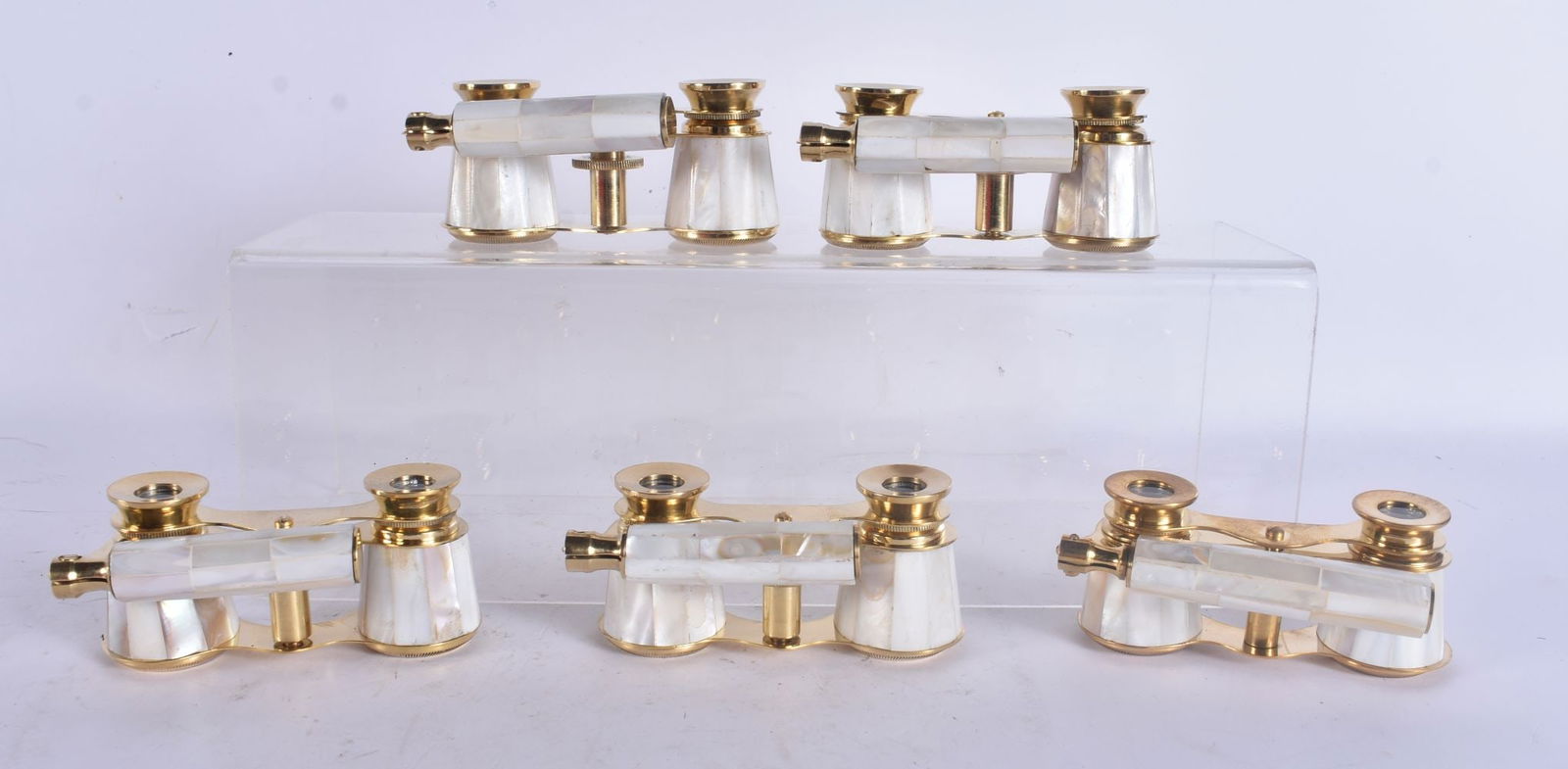 FIVE PAIRS OF MOTHER OF PEARL OPERA GLASSES. Largest 18 cm wide. (5): FIVE PAIRS OF MOTHER OF PEARL OPERA GLASSES. Largest 18 cm wide. (5)