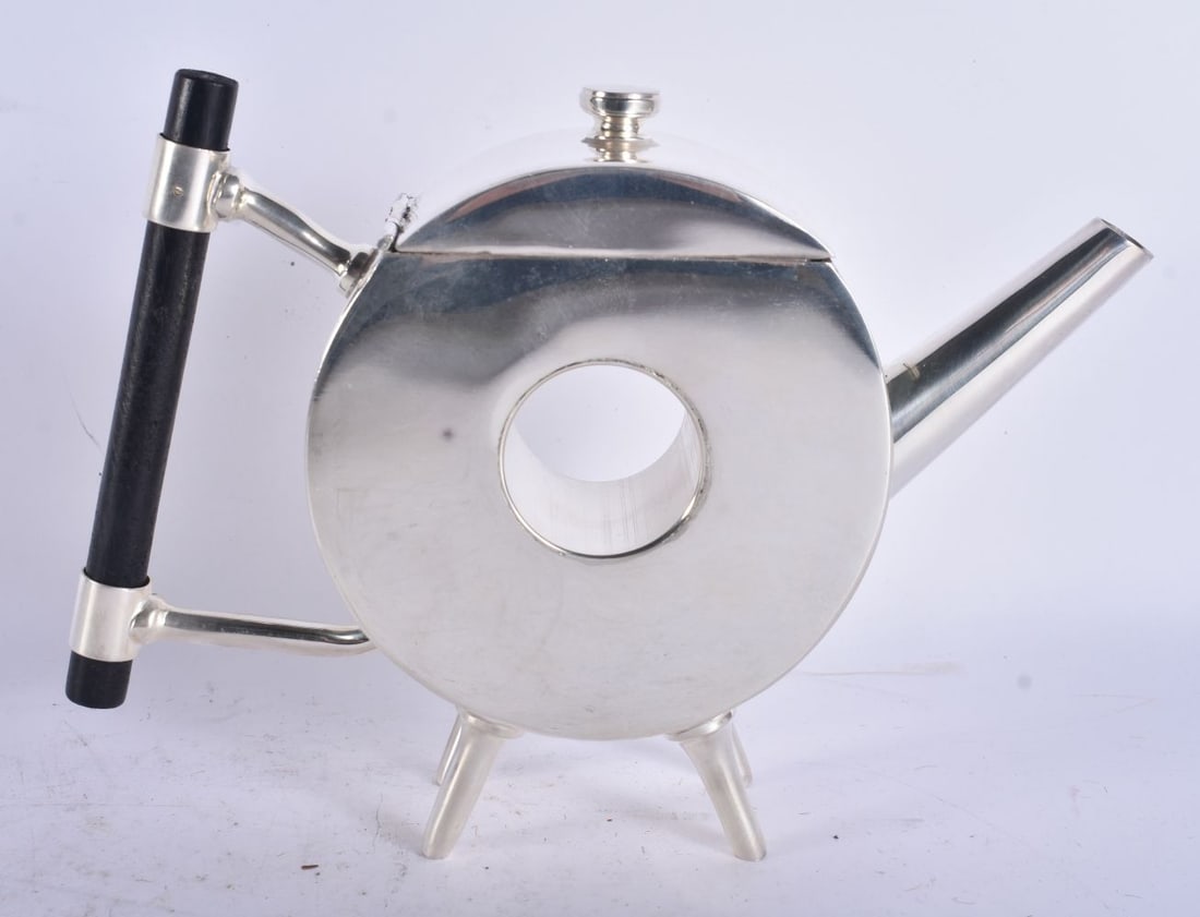 A CHRISTOPHER DRESSER STYLE SILVER PLATED TEAPOT AND COVER. 21 cm x 18 cm.: A CHRISTOPHER DRESSER STYLE SILVER PLATED TEAPOT AND COVER. 21 cm x 18 cm.