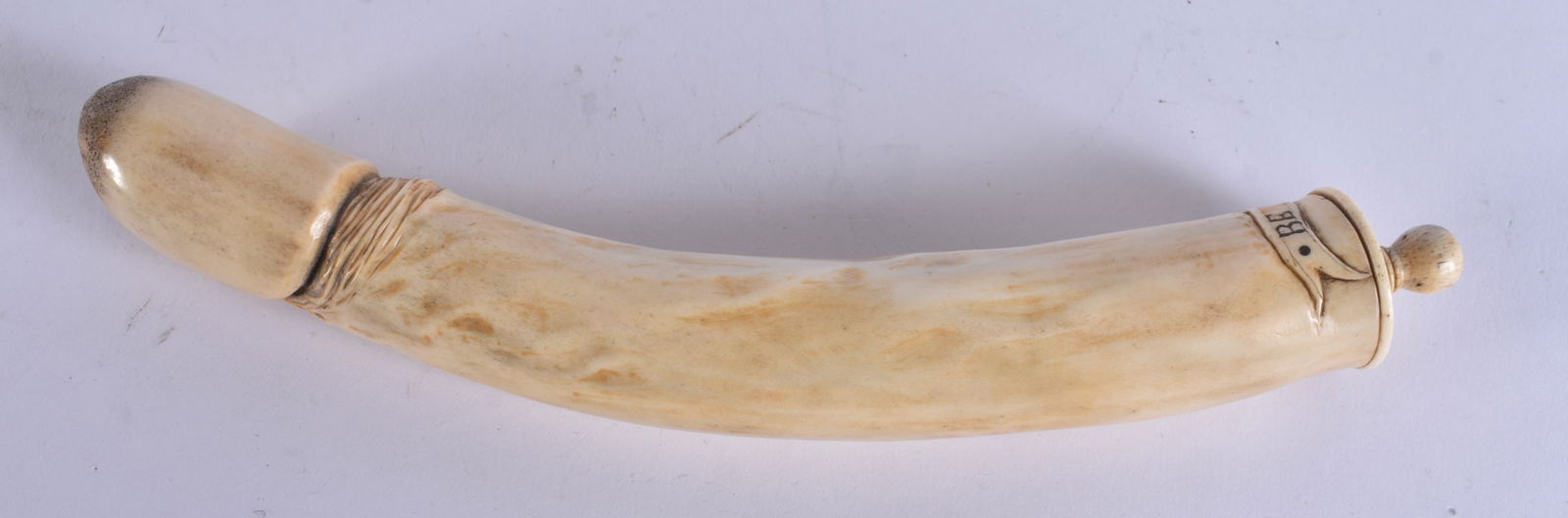 A VERY RARE MID 19TH CENTURY CARVED HUNTING STAG ANTLER EROTIC POWDER FLASK formed as a large phallu: A VERY RARE MID 19TH CENTURY CARVED HUNTING STAG ANTLER EROTIC POWDER FLASK formed as a large phallus. 23 cm long.