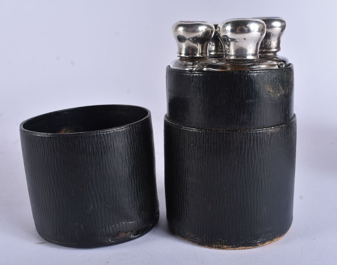 AN UNUSUAL ANTIQUE ASPREY'S OF LONDON SILVER AND ENAMEL SCENT BOTTLE SET within fitted leather case. (1 of 5)