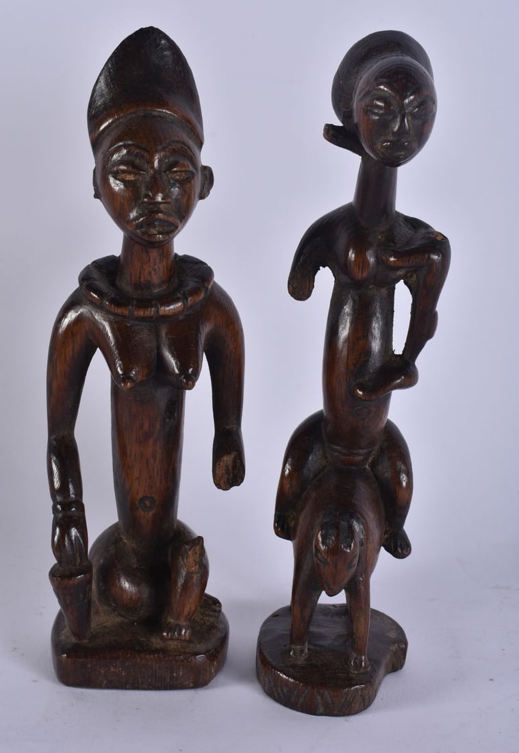 A PAIR OF AFRICAN TRIBAL CARVED WOOD FIGURES. 20 cm long. (1 of 6)