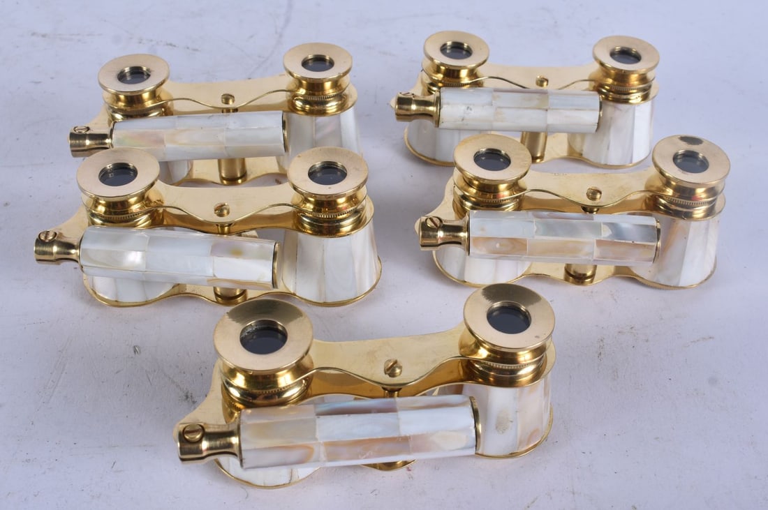 FIVE PAIRS OF MOTHER OF PEARL OPERA GLASSES. Largest 18 cm wide extended. (5): FIVE PAIRS OF MOTHER OF PEARL OPERA GLASSES. Largest 18 cm wide extended. (5)