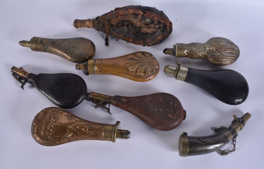 A COLLECTION OF ANTIQUE POWDER FLASKS. Largest 18 cm long. (qty): A COLLECTION OF ANTIQUE POWDER FLASKS. Largest 18 cm long. (qty)