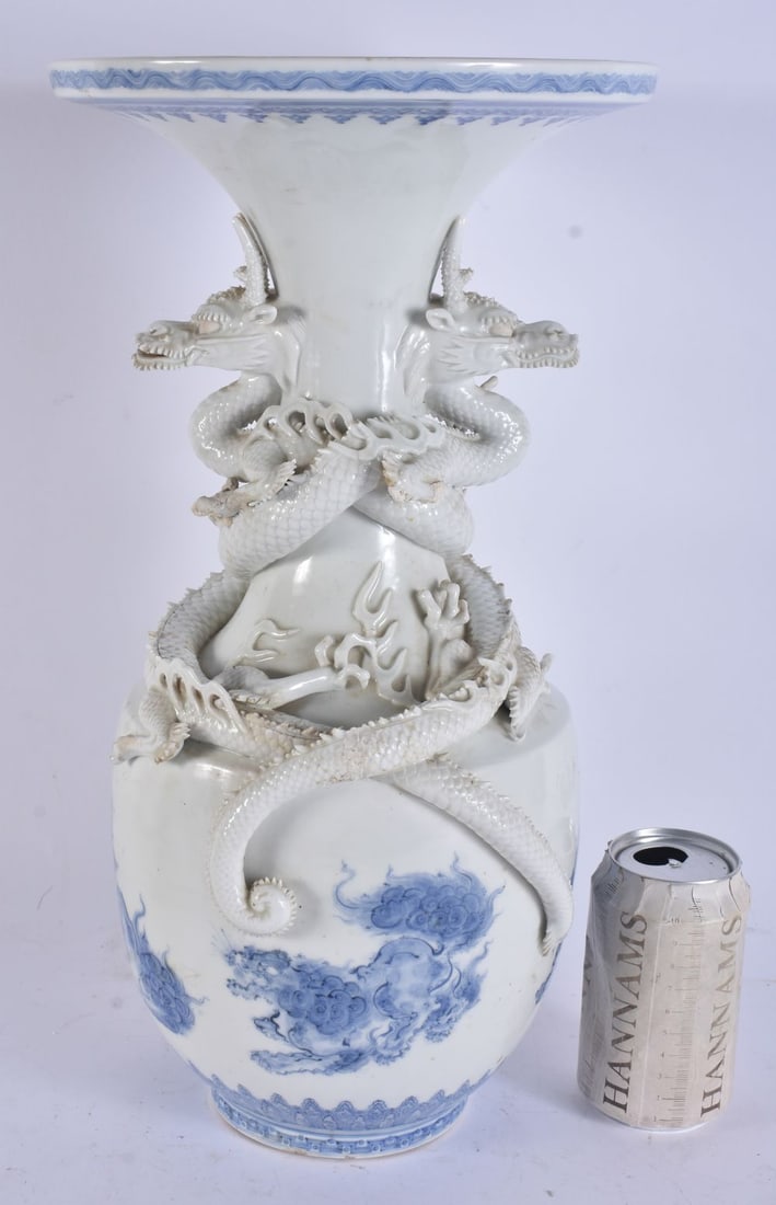 A LARGE 19TH CENTURY JAPANESE MEIJI PERIOD BLUE AND WHITE HIRADO PORCELAIN DRAGON VASE painted with: A LARGE 19TH CENTURY JAPANESE MEIJI PERIOD BLUE AND WHITE HIRADO PORCELAIN DRAGON VASE painted with Buddhistic lions. 40 cm x 22 cm.