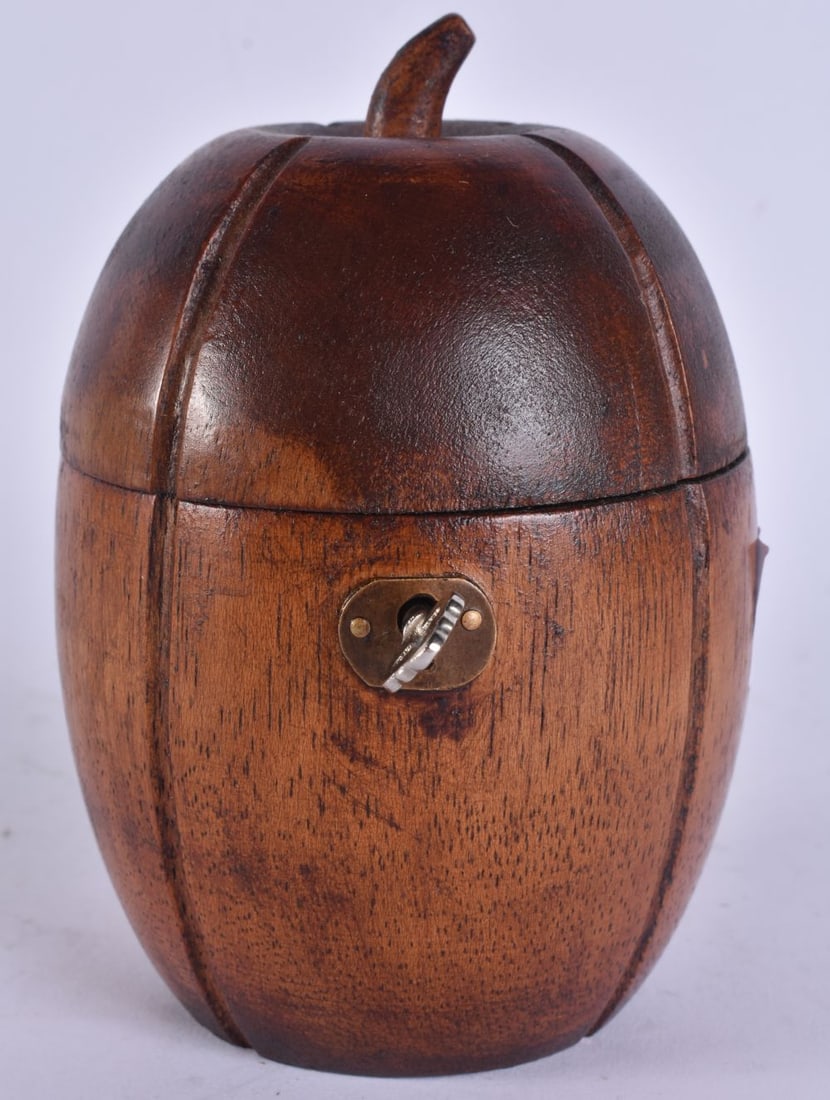 A CARVED WOOD APPLE TEA CADDY. 15 cm high. (1 of 5)