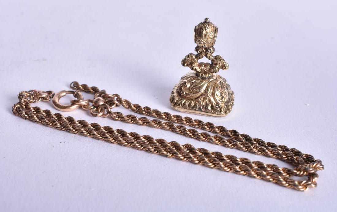 AN ANTIQUE YELLOW METAL SEAL NECKLACE. 15.6 grams. 3 cm x 2 cm. (1 of 3)