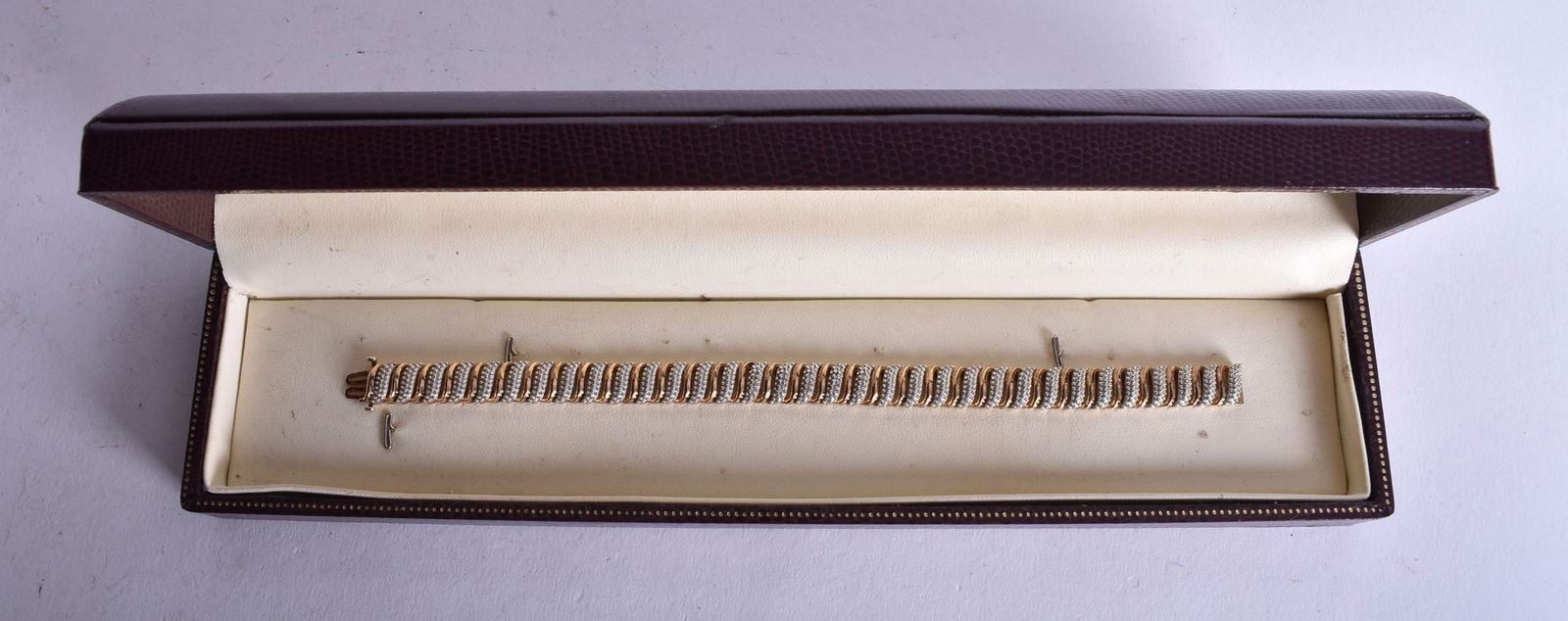 A Cased 10 Carat Gold Plated Silver and Diamond Bracelet. Stamped 10CT and 925. 18.5cm x 0.9cm, weig (1 of 5)