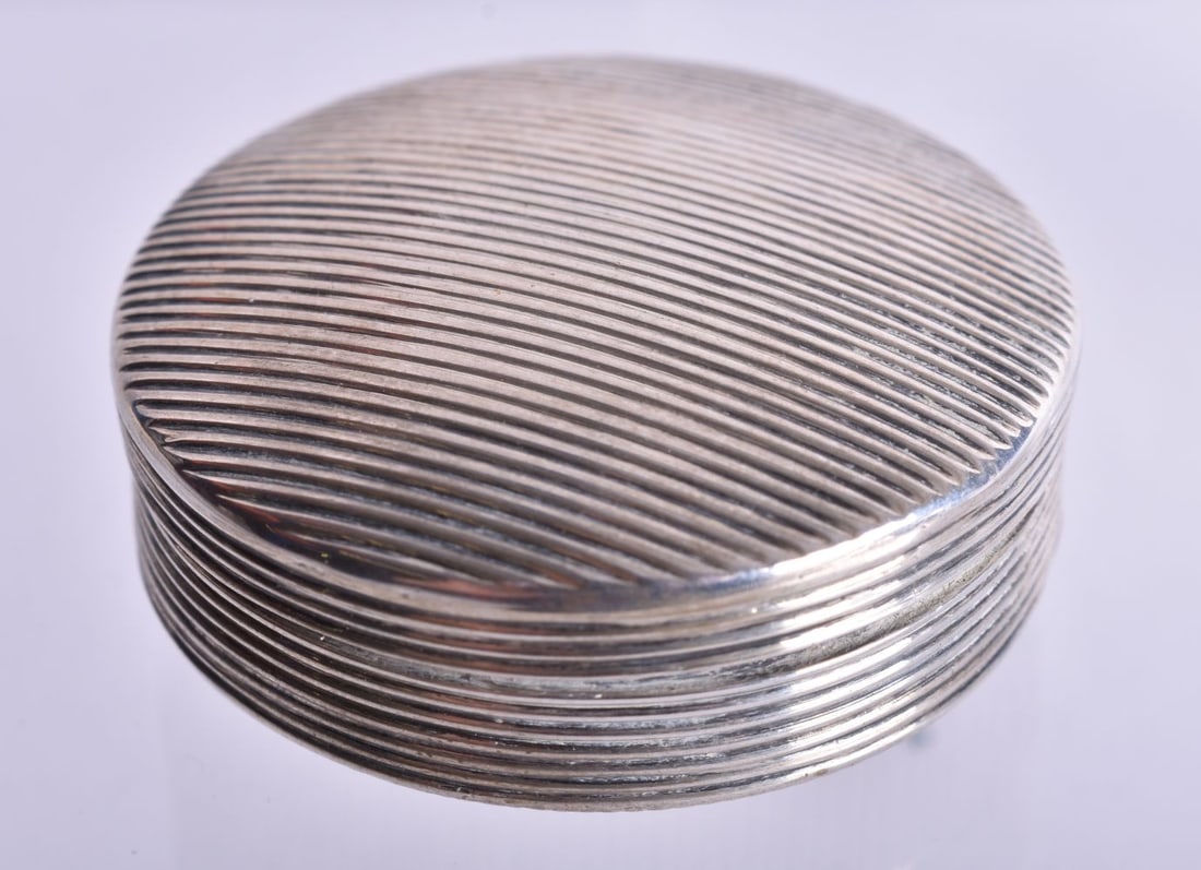 A Continental Silver Snuff Box with Engine Turned Decoration. Foreign Marks. 4.4cm x 2cm, weight 28. (1 of 4)