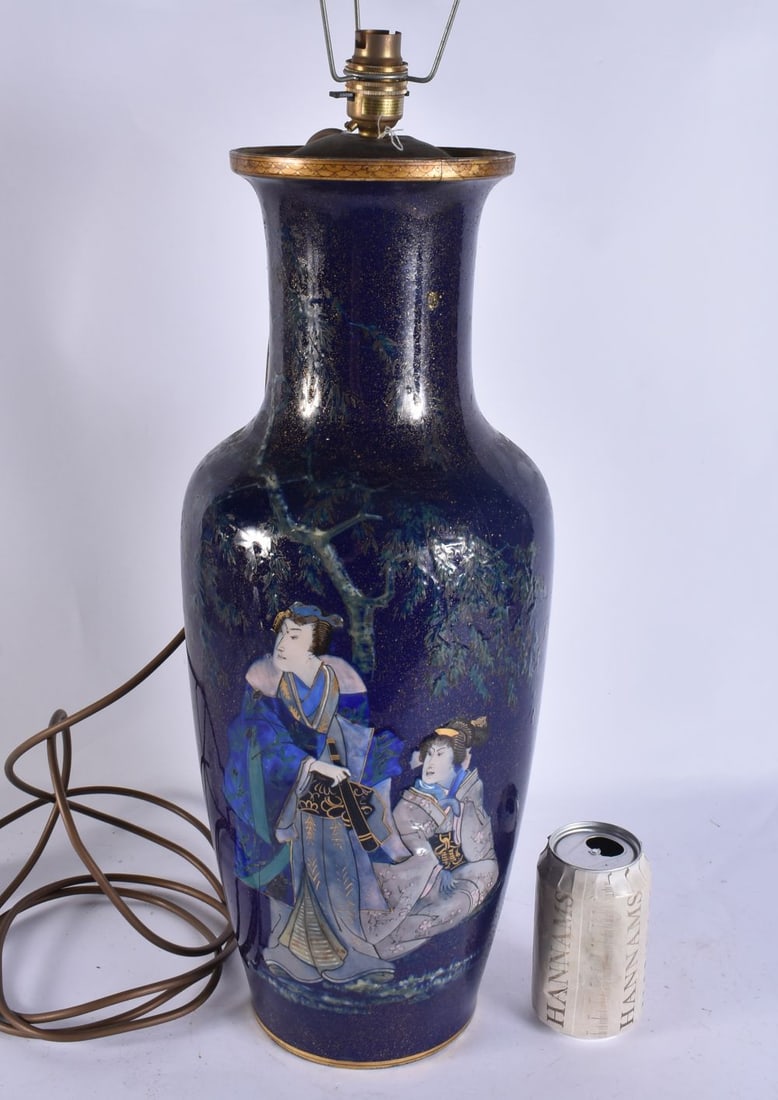 A LARGE 19TH CENTURY FRENCH PORCELAIN AESTHETIC MOVEMENT LAMP relief decorated with figures in a lan: A LARGE 19TH CENTURY FRENCH PORCELAIN AESTHETIC MOVEMENT LAMP relief decorated with figures in a landscape. 67 cm high.