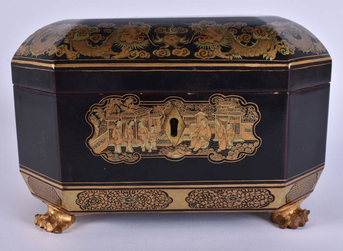 AN EARLY 19TH CENTURY CHINESE EXPORT BLACK LACQUER TEA CADDY Qing, with pewter fitted compartments.