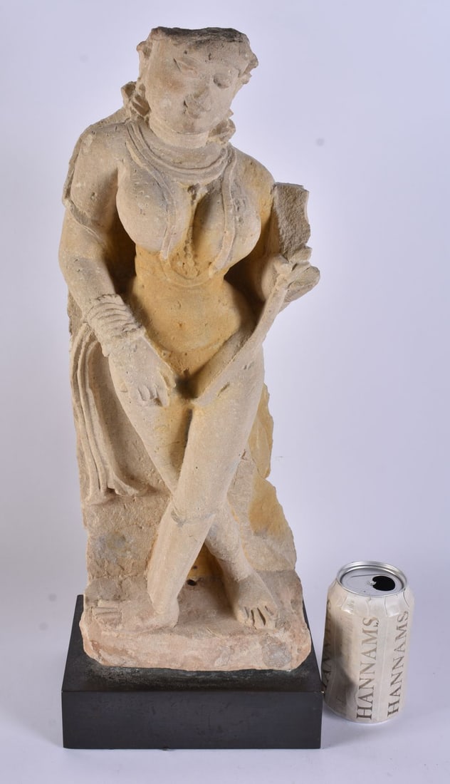 A CENTRAL INDIAN PALE STONE FIGURE OF A FEMALE DEITY, PROBABLY AN EROTIC WORK IN HINDI AS A RESPONSE: A CENTRAL INDIAN PALE STONE FIGURE OF A FEMALE DEITY, PROBABLY AN EROTIC WORK IN HINDI AS A RESPONSE TO THE MORE AUSTERE BUDDHISM. SUCH WORKS ARE USUALLY FROM THE NINTH CENTURY. 40cm high