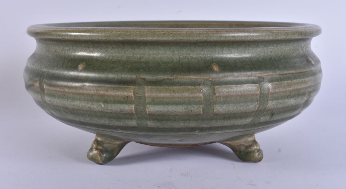 A MING CHINESE LONGQUAN CELADON TRIPOD CENSER DECORATED WITH THE EIGHT TRIGRAMS. 25cm wide: A MING CHINESE LONGQUAN CELADON TRIPOD CENSER DECORATED WITH THE EIGHT TRIGRAMS. 25cm wide