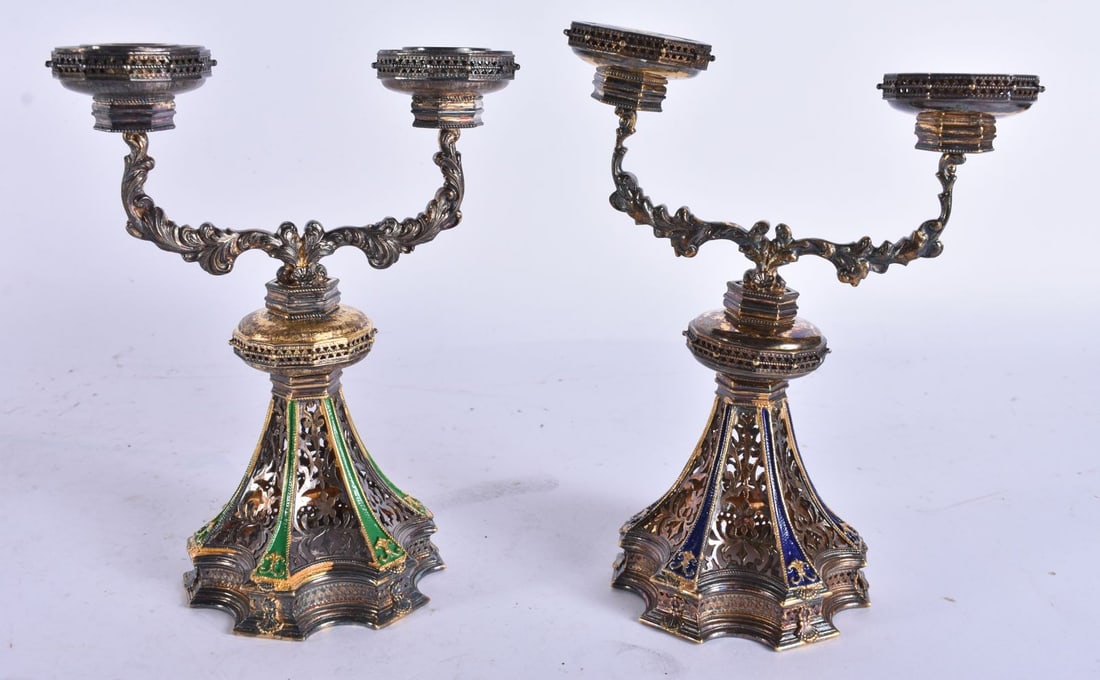 A PAIR OF AUSTRO HUNGARIAN SILVER AND ENAMEL RETICULATED CANDLESTICKS. 486 grams. 15 cm high.: A PAIR OF AUSTRO HUNGARIAN SILVER AND ENAMEL RETICULATED CANDLESTICKS. 486 grams. 15 cm high.