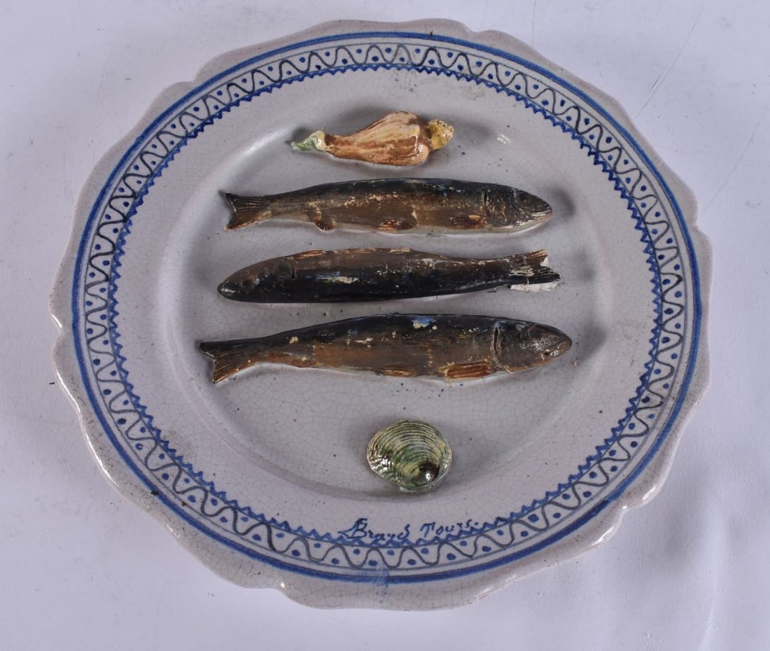 A RARE FRENCH LEON BRARD TROMPE OEIL SARDINE POTTERY PLATE. 22 cm wide.: A RARE FRENCH LEON BRARD TROMPE OEIL SARDINE POTTERY PLATE. 22 cm wide.