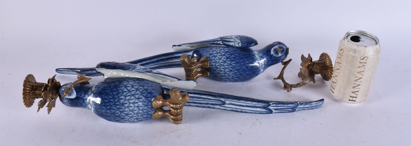 A LARGE PAIR OF CONTINENTAL PARROT CANDLESTICKS. 50 cm long.: A LARGE PAIR OF CONTINENTAL PARROT CANDLESTICKS. 50 cm long.