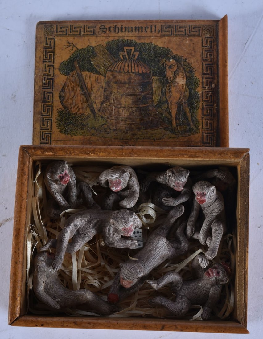A GROUP OF TERRACOTTA MONKEYS within an Austrian wood box. 12 cm x 9.5 cm. (qty): A GROUP OF TERRACOTTA MONKEYS within an Austrian wood box. 12 cm x 9.5 cm. (qty)