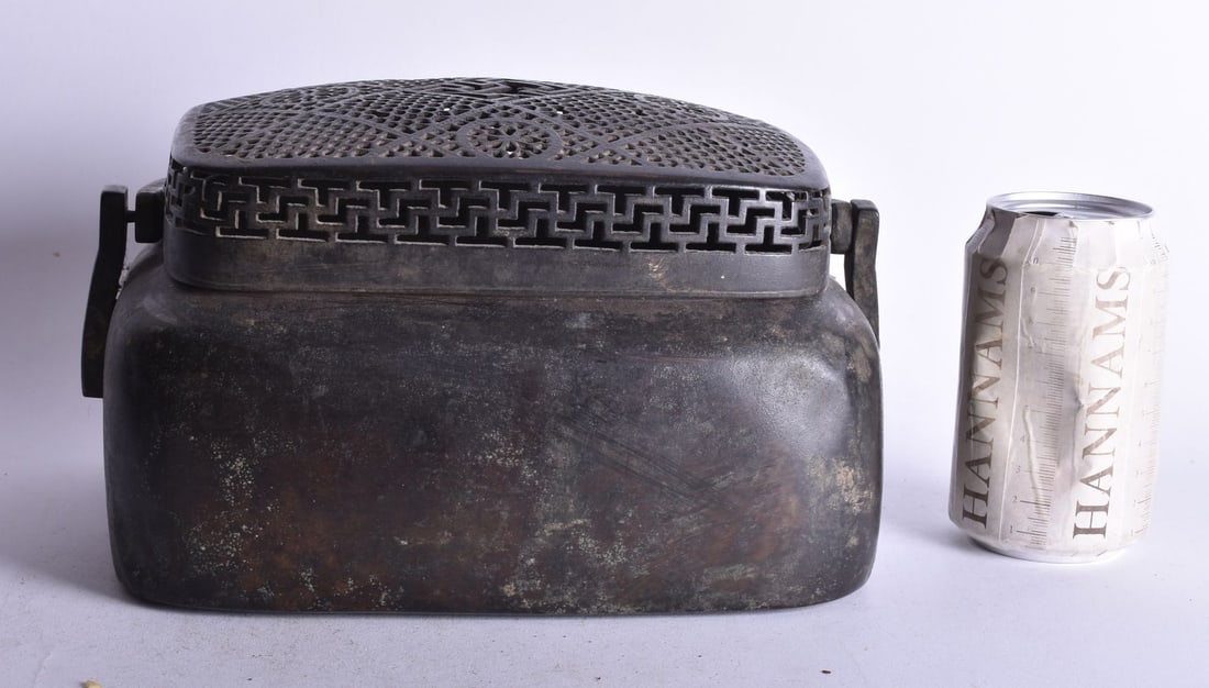 A LARGE 19TH CENTURY CHINESE BRONZE HAND WARMER AND COVER Late Qing. 27 cm x 20 cm.