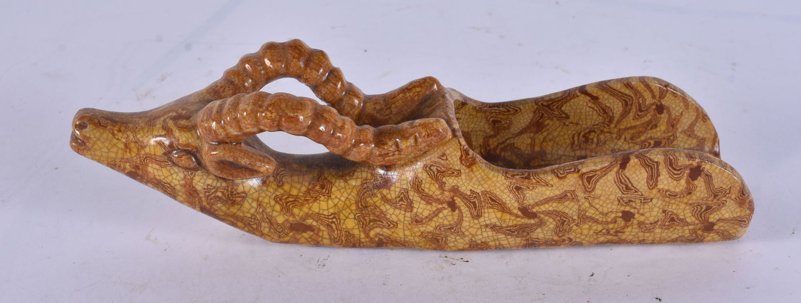 A CHINESE MARBLEISED POTTERY DEER HEAD SCOOP. 17 cm wide.: A CHINESE MARBLEISED POTTERY DEER HEAD SCOOP. 17 cm wide.