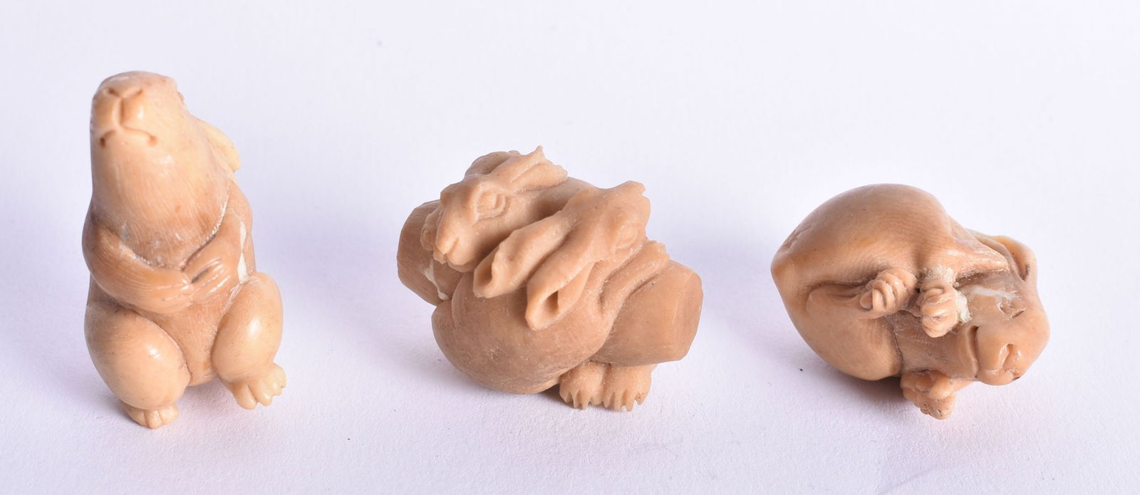 THREE JAPANESE TAG NUT NETSUKES. 30 grams. 3.75 cm x 2.25 cm. (3) (1 of 3)