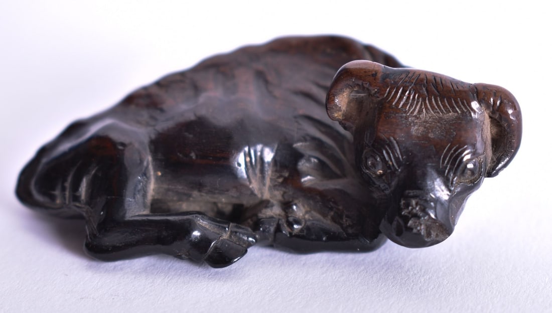 AN 18TH/19TH CENTURY JAPANESE EDO PERIOD CARVED WOOD BULL NETSUKE. 11.5 grams. 6 cm x 3.5 cm. (1 of 3)
