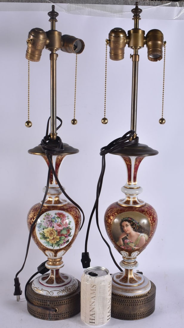 A FINE PAIR OF 19TH CENTURY BOHEMIAN GLASS PORTRAIT LAMPS painted on a red and opaque white ground.: A FINE PAIR OF 19TH CENTURY BOHEMIAN GLASS PORTRAIT LAMPS painted on a red and opaque white ground. 62 cm high.