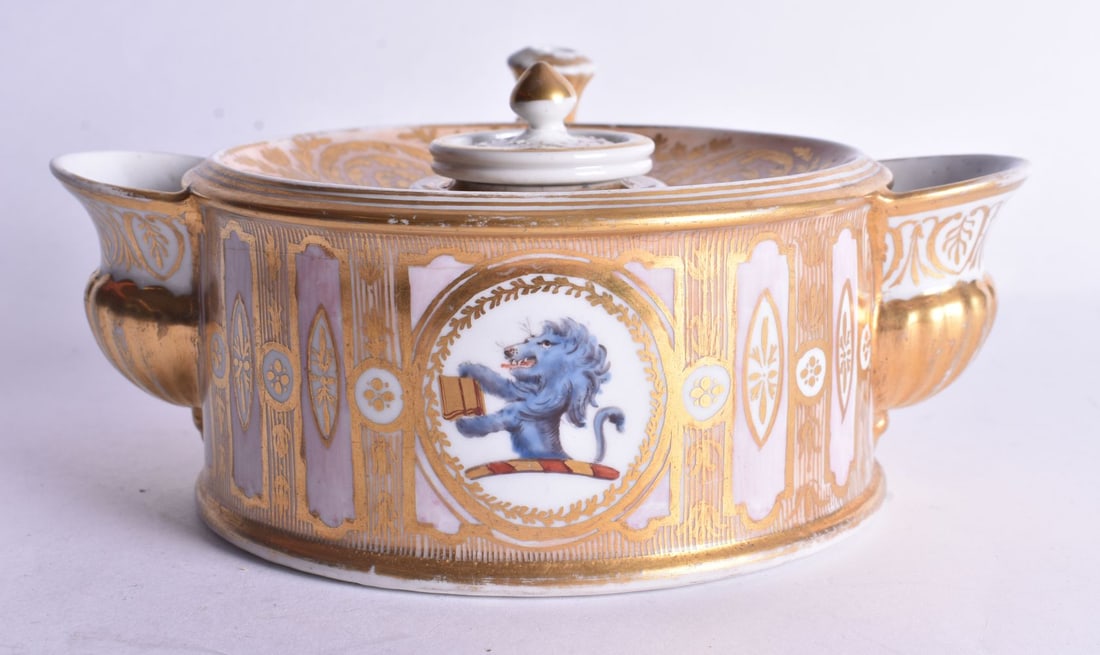 18th century Coalport drum shaped inkwell, gilt scroll handle with taper stick finial, quill stands: 18th century Coalport drum shaped inkwell, gilt scroll handle with taper stick finial, quill stands and half fluted water or sand fonts to side, decorated with elaborate gilding on a salmon ground, in