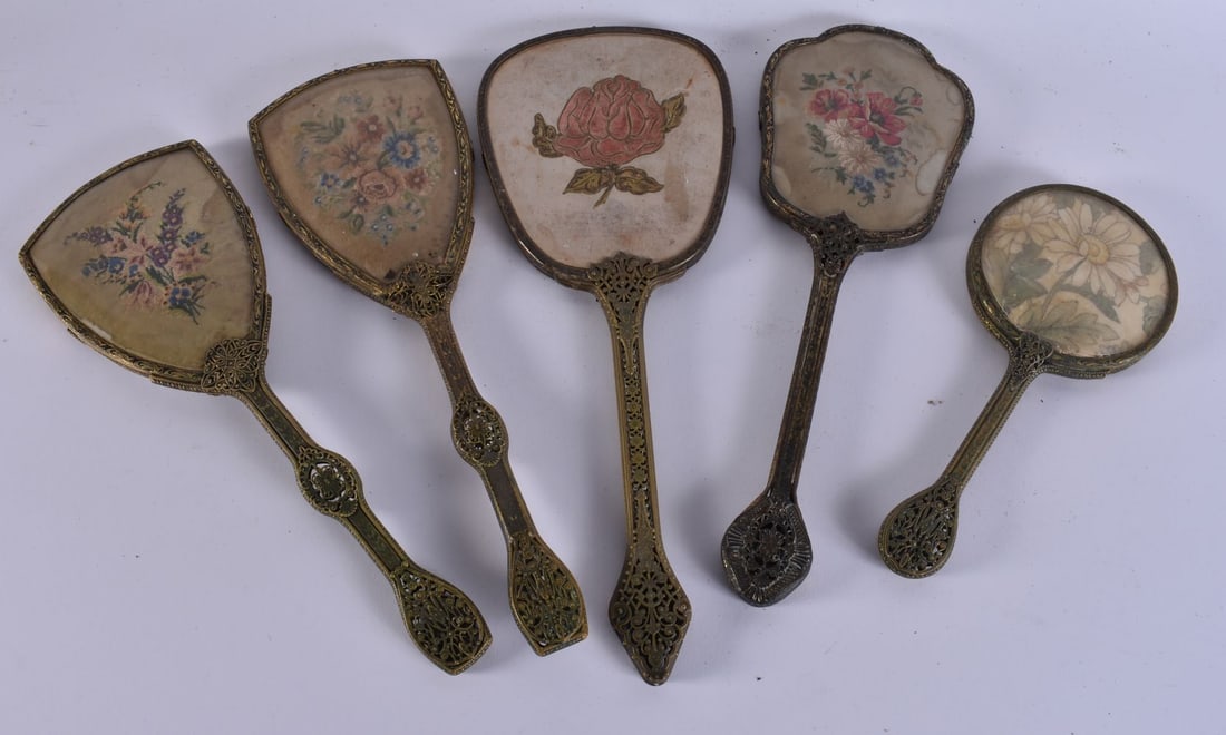 FIVE VINTAGE EMBROIDERED GILT METAL VANITY MIRRORS. 38 cm long. (5) (1 of 4)