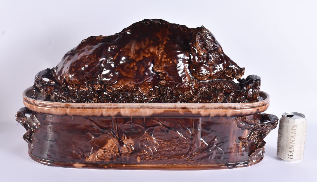 A RARE LARGE 19TH CENTURY CONTINENTAL TREACLE GLAZED GAME TUREEN AND COVER formed with a large wild (1 of 12)