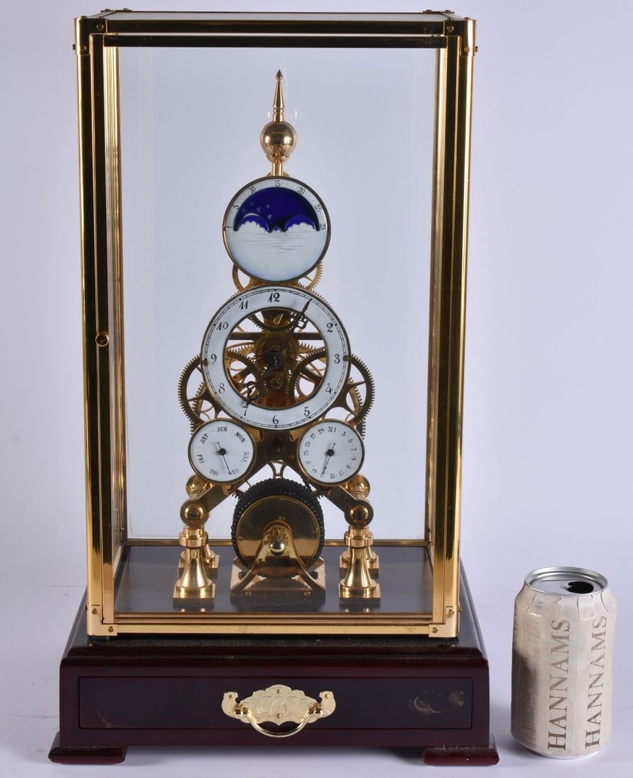 AN UNUSUAL SKELETON MOONPHASE CLOCK with two subsidiary dials. 48 cm x 24 cm. (1 of 8)