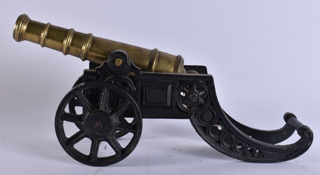 AN ANTIQUE BRONZE AND CAST IRON CANNON. 45 cm wide. (1 of 5)