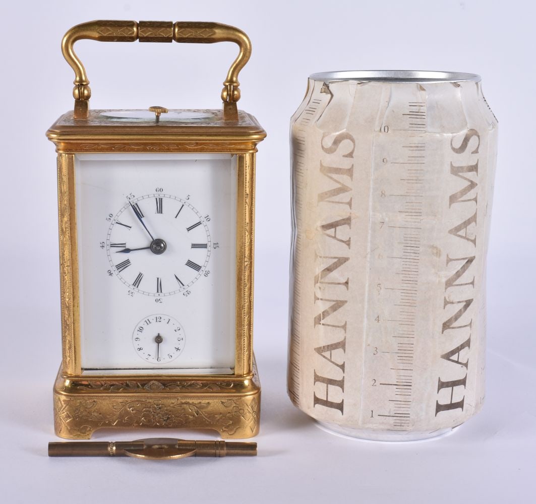 A DIMINUTIVE 19TH CENTURY FRENCH REPEATING BRASS CARRIAGE CLOCK with alarm, engraved with foliage. 1: A DIMINUTIVE 19TH CENTURY FRENCH REPEATING BRASS CARRIAGE CLOCK with alarm, engraved with foliage. 12.5 cm high inc handle.