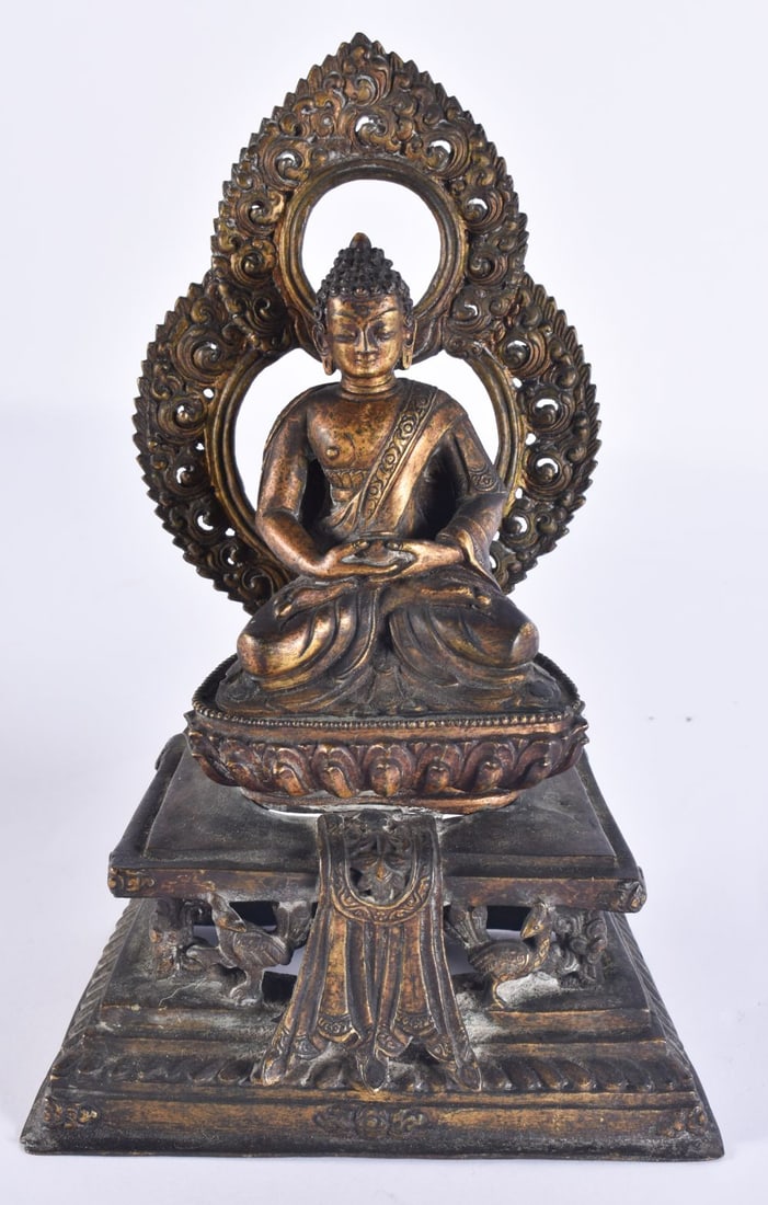 AN 18TH/19TH CENTURY NEPALESE TIBETAN BRONZE BUDDHA modelled behind a flaming shrine. 22 cm x 10 cm. (1 of 10)