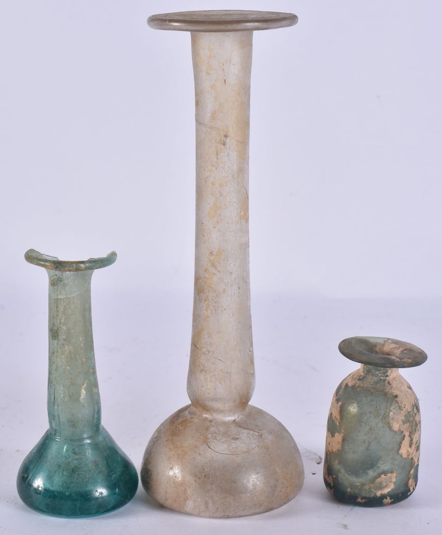 THREE ANTIQUITY ROMAN GLASS PERFUME BOTTLES. Largest 16.5 cm high. (3) (1 of 4)