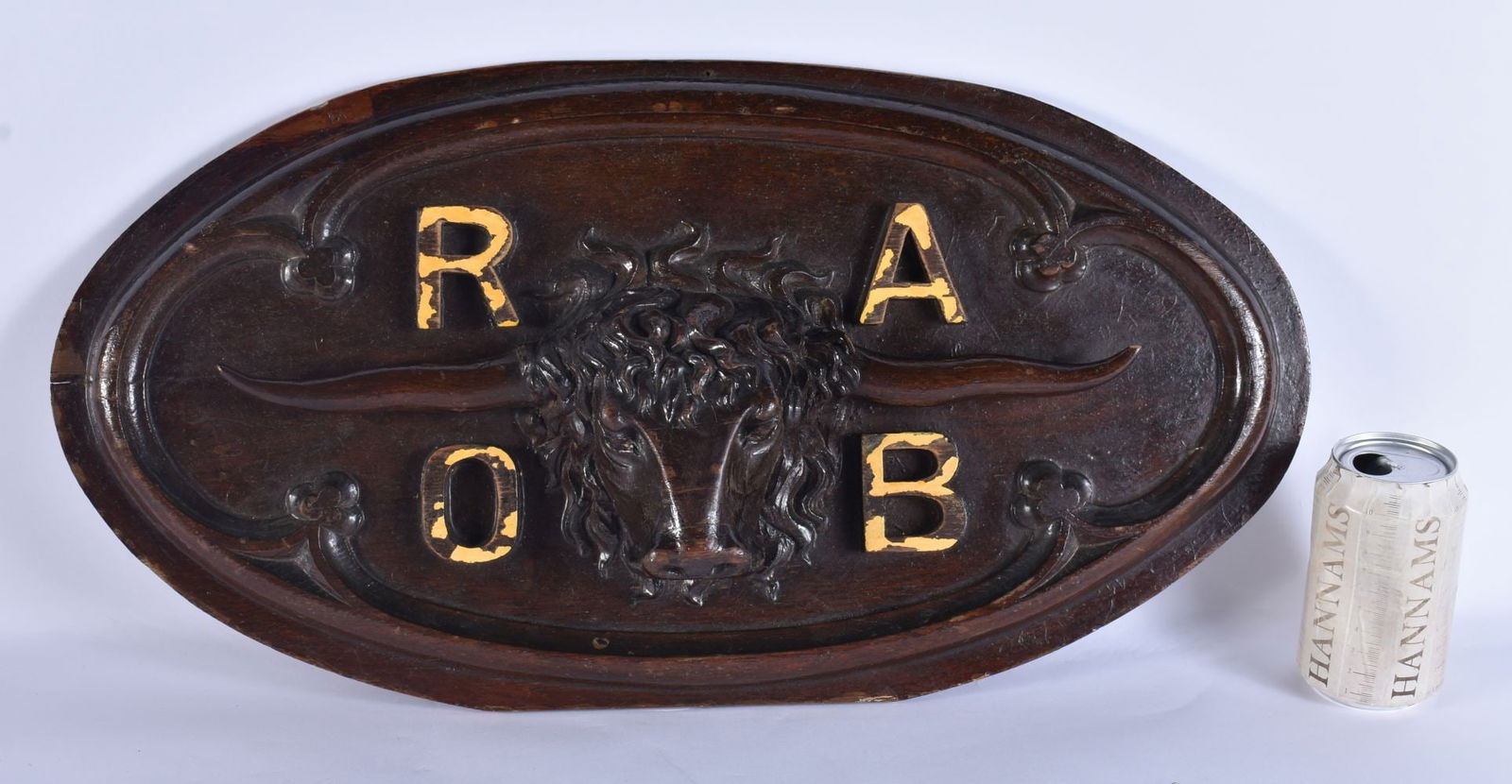 A 19TH CENTURY CARVED OAK WALL PLAQUE FOR THE ROYAL ANTEDILUVIAN ORDER OF BUFFALOES (RAOB) of oval f: A 19TH CENTURY CARVED OAK WALL PLAQUE FOR THE ROYAL ANTEDILUVIAN ORDER OF BUFFALOES (RAOB) of oval form with carved bull and gilt initials for the Royal Antediluvian Order of Buffaloes (RAOB), which i