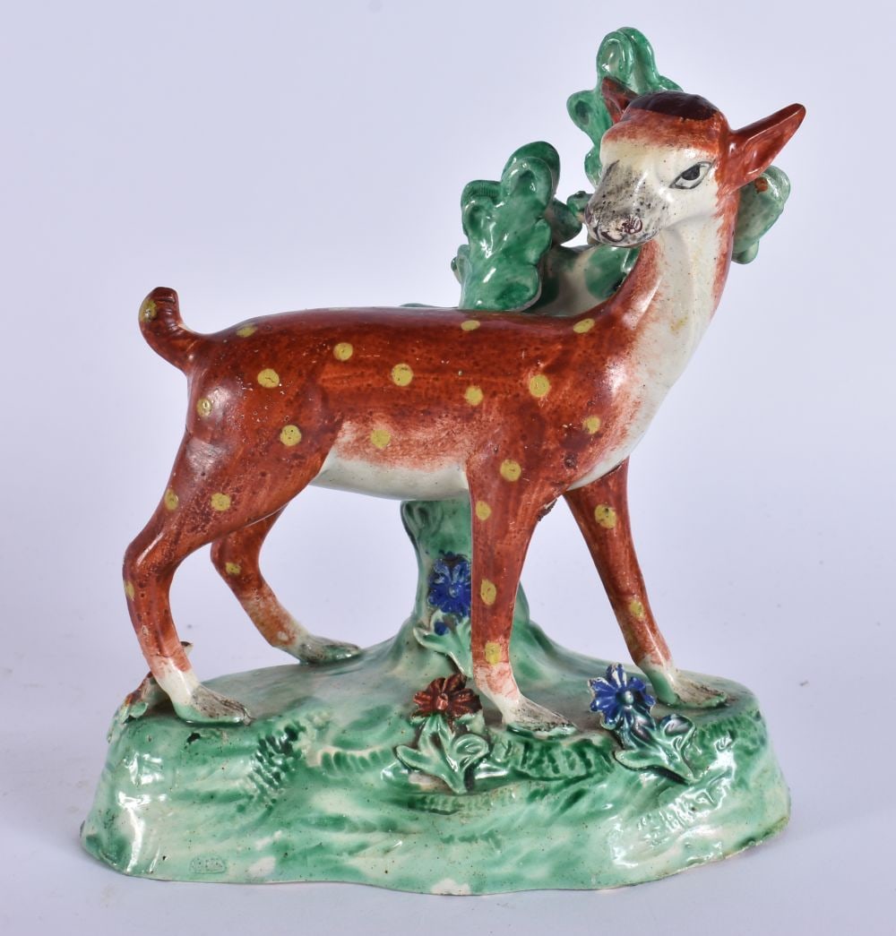 AN EARLY 19TH CENTURY ENGLISH STAFFORDSHIRE POTTERY FIGURE OF A RED DEER. 18 cm x 12 cm. (1 of 5)