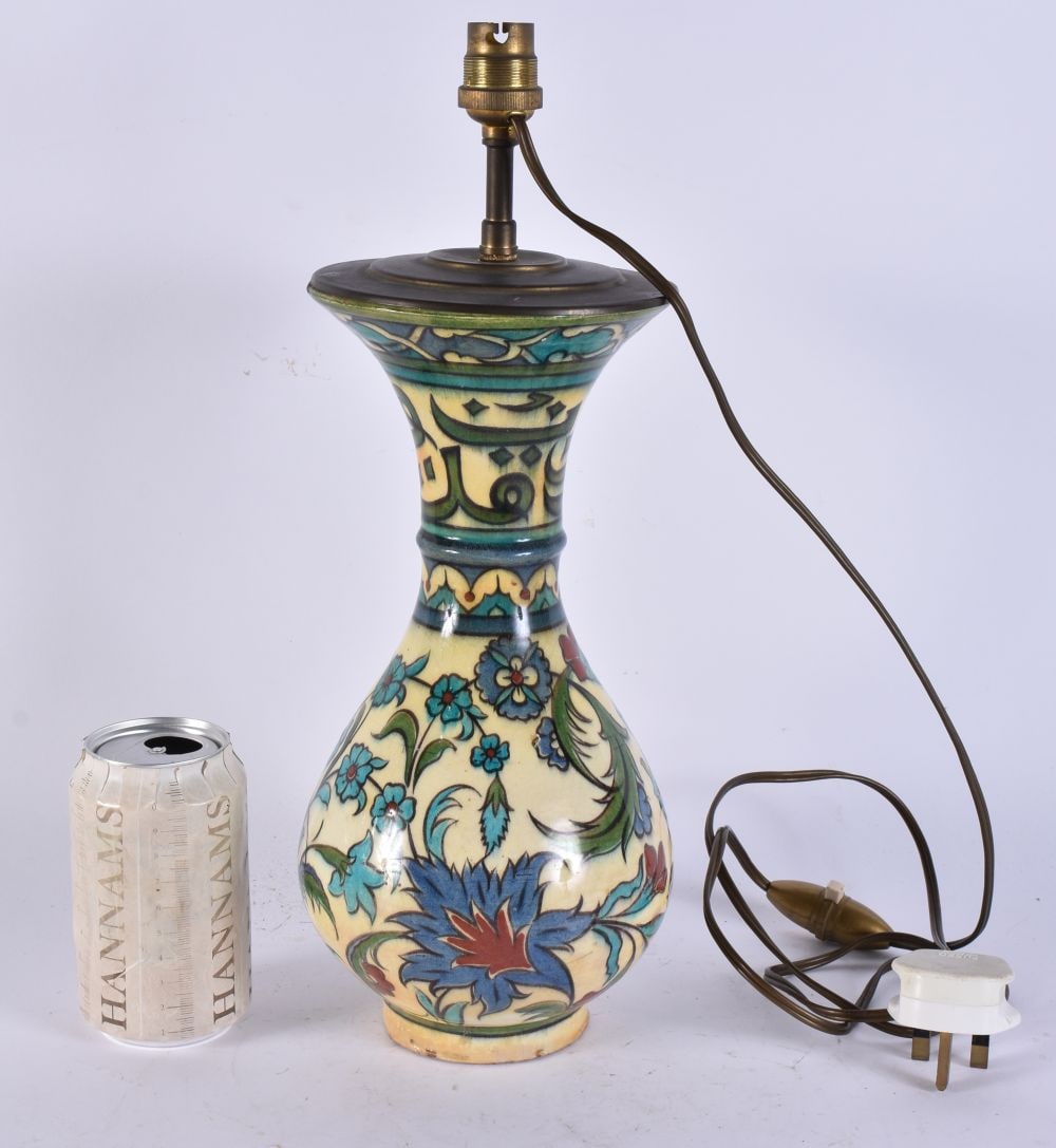 AN ANTIQUE IZNIK MIDDLE EASTERN FAIENCE LAMP painted with flowers. 37 cm high. (1 of 6)