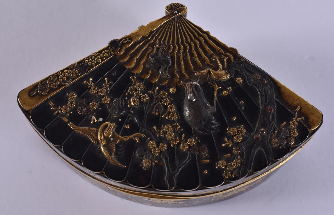 A 19TH CENTURY JAPANESE MEIJI PERIOD BRONZE GOLD ONLAID FAN SHAPED BOX decorated with birds amongst (1 of 8)