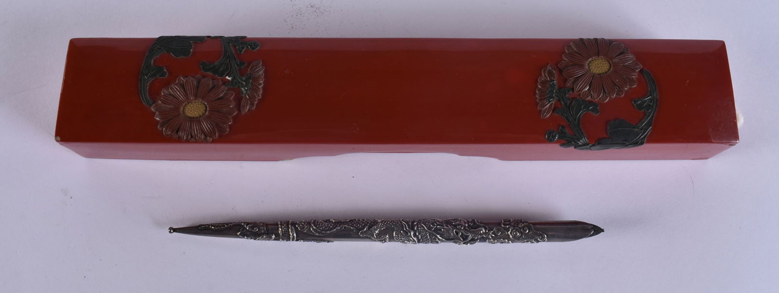 A 19TH CENTURY JAPANESE MEIJI PERIOD SLIDING RED LACQUER PEN BOX containing a silver dragon pen. 25 (1 of 8)