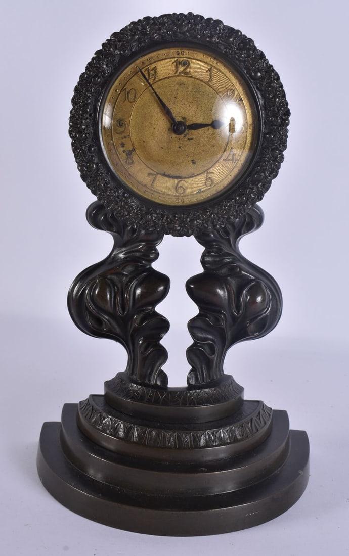 A 19TH CENTURY BRONZE SCROLLING FOLIATE CLOCK with gilt dial and stepped base. 26 cm x 12 cm. (1 of 5)