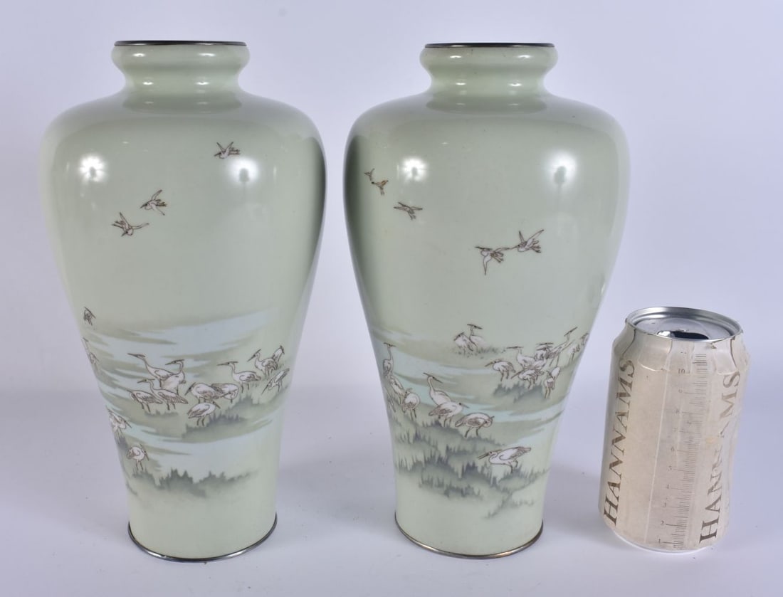 A PAIR OF LATE 19TH CENTURY JAPANESE MEIJI PERIOD SILVER CLOISONNE ENAMEL VASES decorated with birds: A PAIR OF LATE 19TH CENTURY JAPANESE MEIJI PERIOD SILVER CLOISONNE ENAMEL VASES decorated with birds within a wetland landscape. 26 cm high.