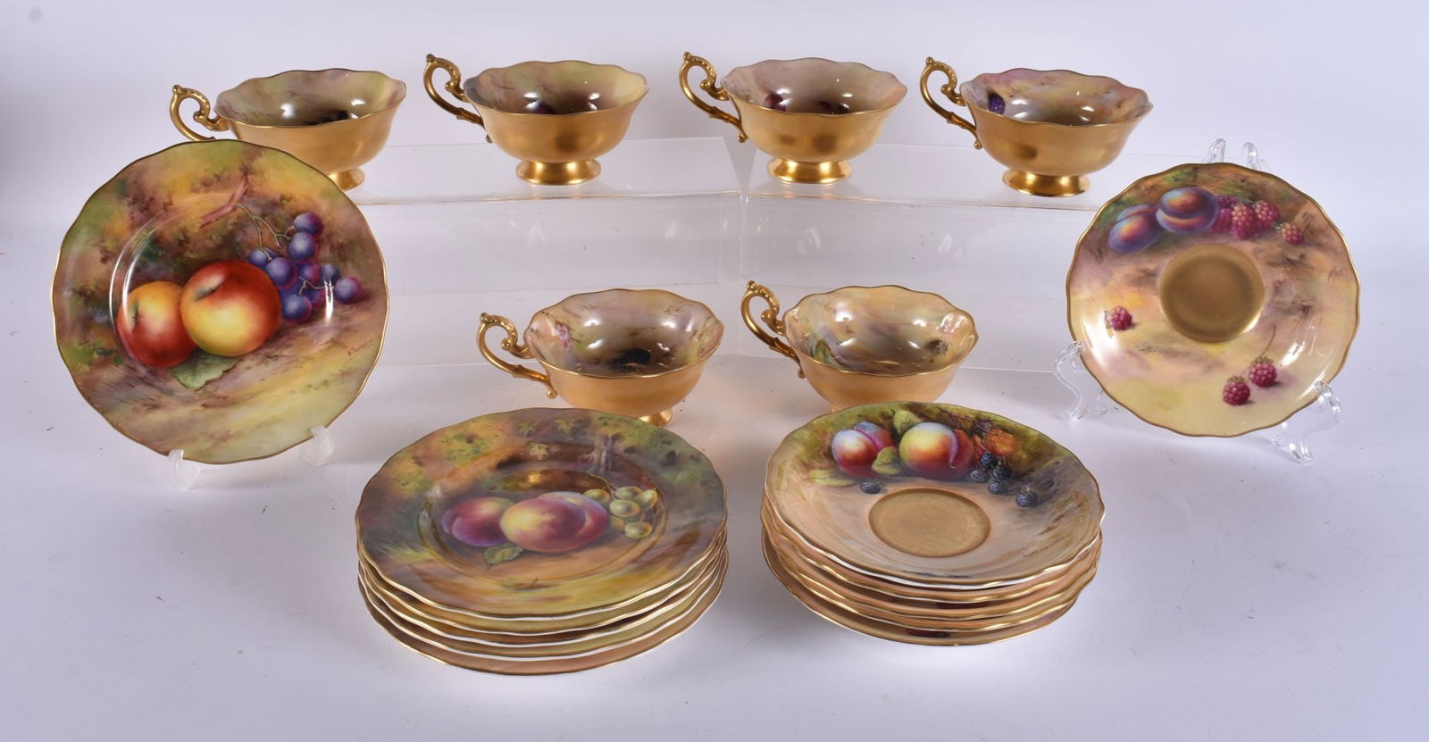 A HARLEQUIN SET OF SIX ROYAL WORCESTER FRUIT PAINTED PORCELAIN TRIOS by assorted artists. (18) (1 of 20)