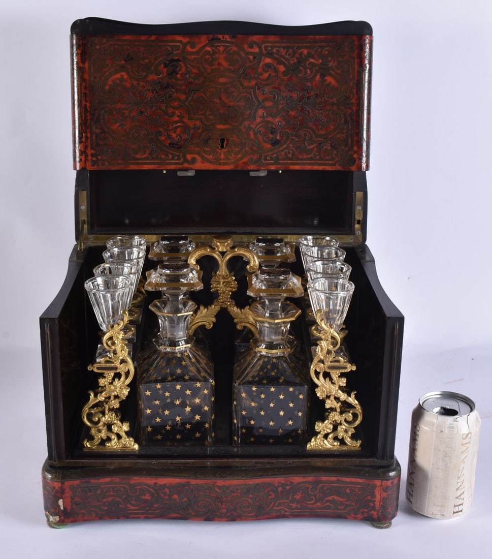 A LARGE MID 19TH CENTURY FRENCH BOULLE TORTOISESHELL CAVE A LIQUOR decorated with foliage and vines. (1 of 6)