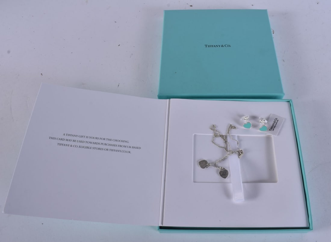 A TIFFANY & CO SILVER NECKLACE together with a pair of tiffany silver earrings. (3) (1 of 6)